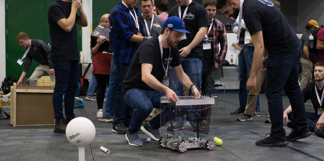 Members tweaking the robot